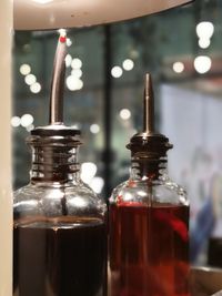 Close-up of glass bottle on table