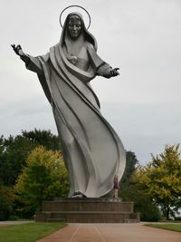 Low angle view of statue against sky