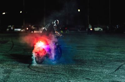 View of illuminated street lights at night