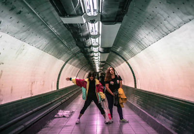 Rear view of people at subway station