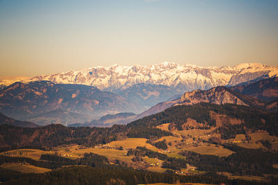 Scenic view of snowcapped mountains against clear sky