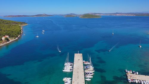 Top view drone above harbor. boats and yachts docked in port. vacation concept