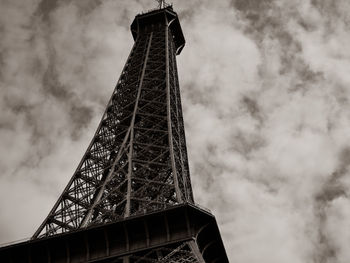 Low angle view of tower against cloudy sky