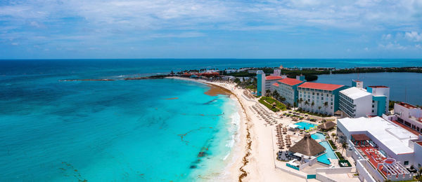 High angle view of swimming pool by sea against sky