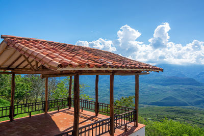 Observation point over green landscape against sky