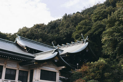 Tilt image of roof and building against sky