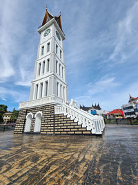 Low angle view of clock tower against sky