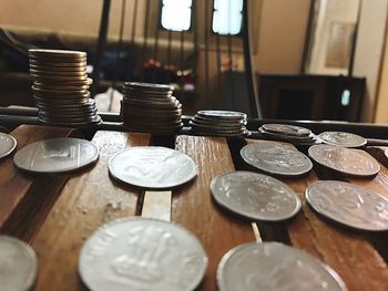 Close-up of coins stacked on table