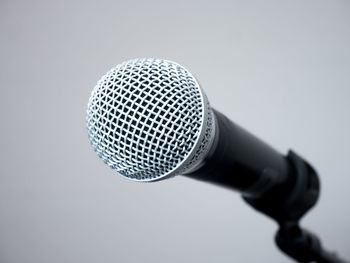 Close-up of electric fan against white background