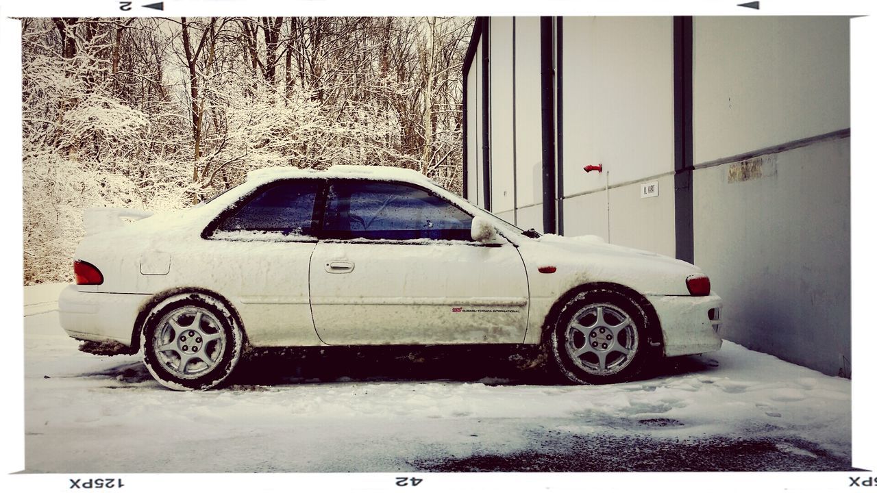 transportation, land vehicle, mode of transport, transfer print, stationary, bicycle, auto post production filter, parked, parking, car, street, road, day, wall - building feature, wheel, architecture, outdoors, no people, built structure, building exterior