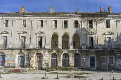 Exterior of old building against sky in city