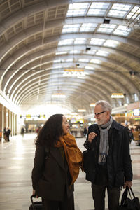 Happy couple at train station