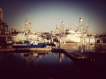 Boats moored at harbor