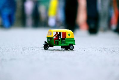 Close-up of toy car on road