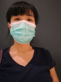 An asian middle-aged woman with a face mask. a single thai woman.