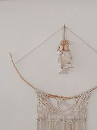 Low angle view of lighting equipment hanging on wall