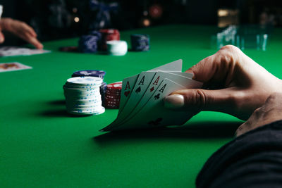 Midsection of person playing with table