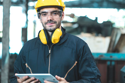 Portrait of man working on mobile phone