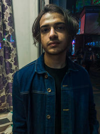 Portrait of young man standing outdoors