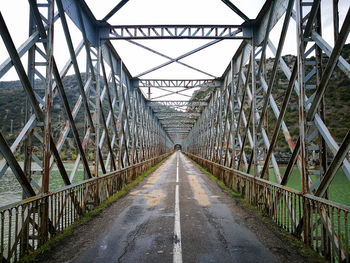 Empty footbridge along road