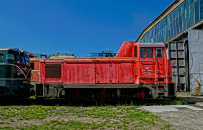 Side view of trains at the depot