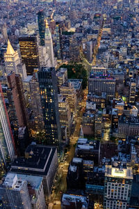 High angle view of illuminated buildings in city