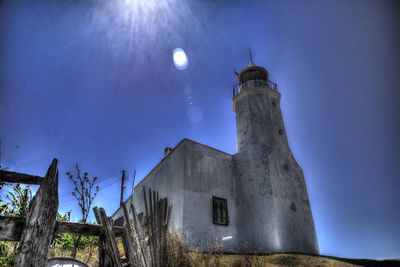 Low angle view of tower against sky at night