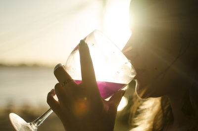 Close-up of hand holding drinking water