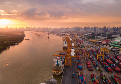 High angle view of commercial dock against sky during sunset