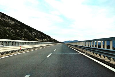 Empty road against sky