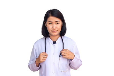 Portrait of a smiling young woman against white background