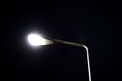 Low angle view of illuminated street light against clear sky
