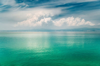 Scenic view of sea against cloudy sky