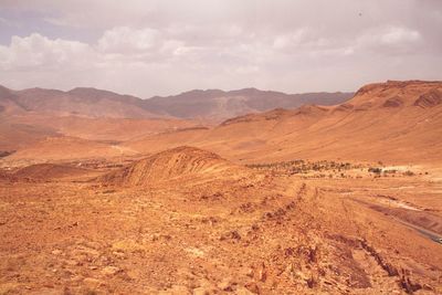 Scenic view of desert against sky during sunset