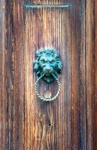 Close-up of wooden door knocker