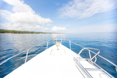 Boat sailing in sea against sky