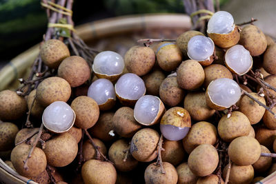 Close-up bunch of ripe longan fruit on bamboo basket