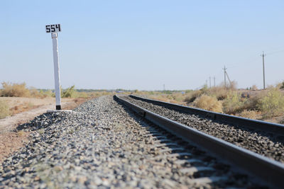 Railroad tracks against clear sky