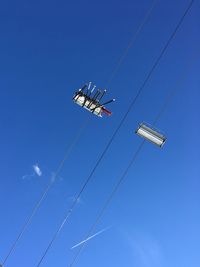 Low angle view of airshow against clear blue sky