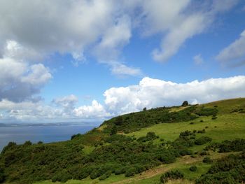 Scenic view of sea against cloudy sky