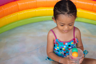 Girl playing in wading pool