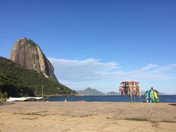 Scenic view of beach against blue sky