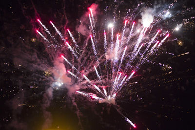 Firework display at night