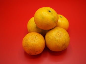 Close-up of apples on orange