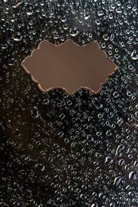 Full frame shot of water drops on black background