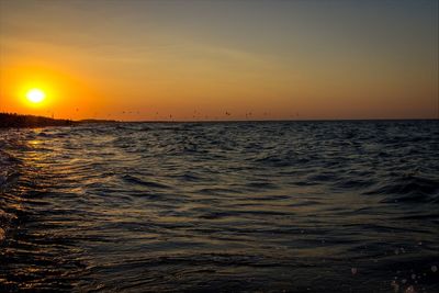 Scenic view of sea at sunset