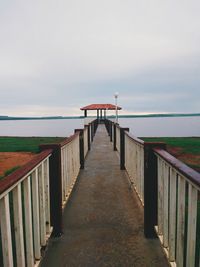 Pier over sea against sky