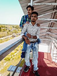 Friends standing on staircase