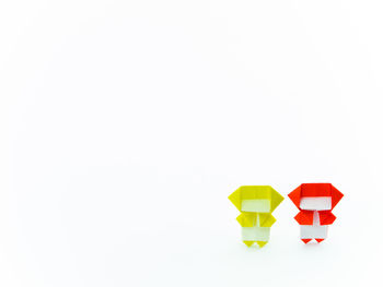 Close-up of multi colored toy over white background