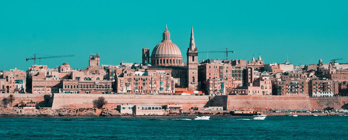 View of buildings against blue sky